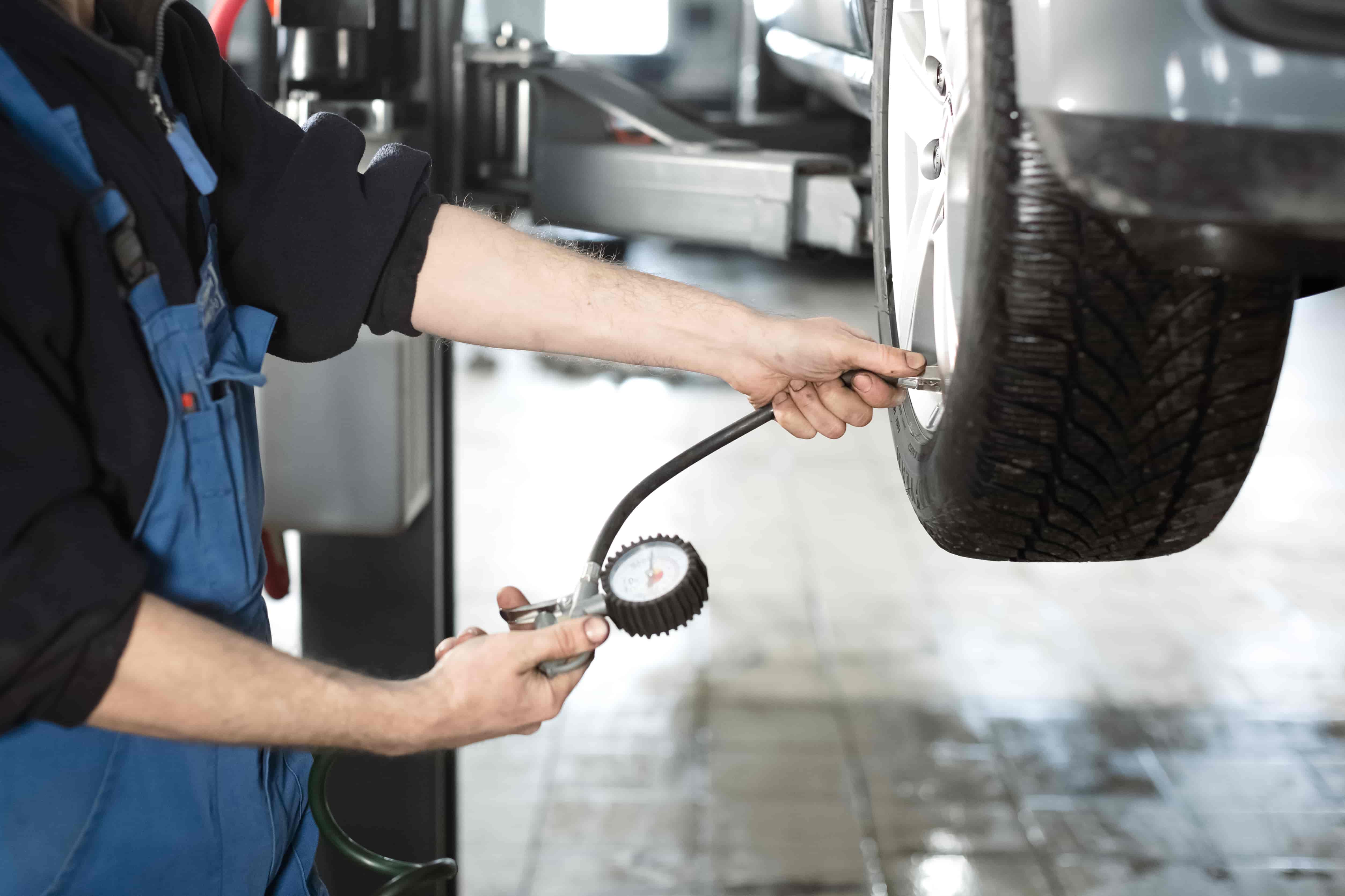 Checking the tire pressure.